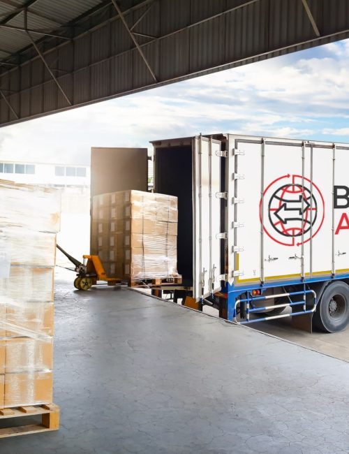 Warehouse staff inspecting and preparing excess stock for collection and resale in the UK